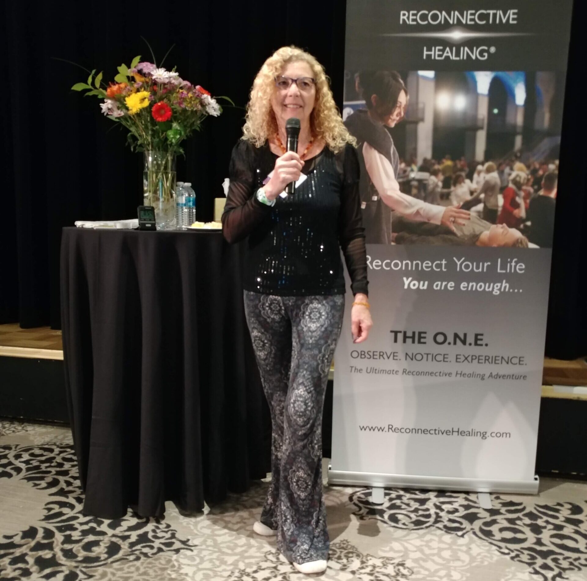 Reconnective Healing Seminar Kathleen on stage